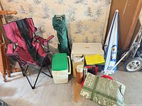 Group shot of both coolers, chairs, umbrella, thermoses, tablecloth