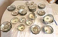 Overhead view of assorted Coalport Indian Tree plates, bowls, cups