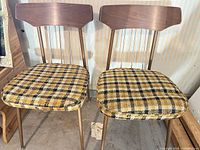 Front view of both matching plaid chairs