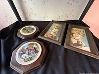 Four wall decor pieces: two landscape plaques and two framed paint-by-number child images