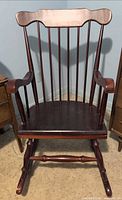 Front view of wooden spindle-back rocking chair