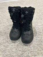 Front view of black Columbia kids winter boots