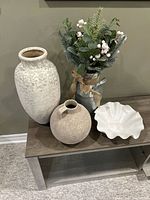 Group shot of both ceramic vases, white bowl and faux floral arrangement