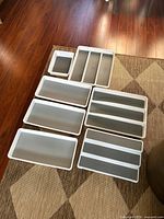 All seven organizers laid out showing sizes and compartments