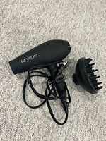 Hair dryer and diffuser shown side by side, cord visible