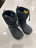 front view of both boots showing overall style, color and wear