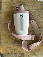 Full view of Stanley insulated bottle with strap attached