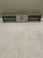 Front view of entire TV stand showing overall design and dimensions.