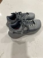 Side view of both shoes showing upper design and laces