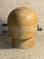Assembled front view of wooden hat block