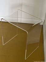 Front view of clear acrylic U-shaped table