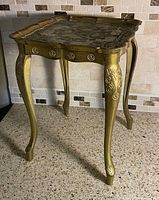 Full view of gilded side table front and top