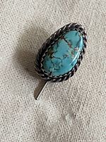 Front view showing turquoise cabochon and rope border