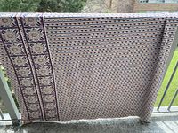 Full piece draped over railing to show overall size and pattern