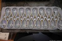 Tray holding 17 clear chandelier drops