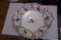 Top view of porcelain bowl showing floral and gilt design