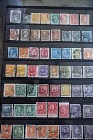 Full view of stock card displaying five rows of Canadian stamps