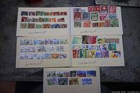 Five stock cards filled with Swiss postage stamps laid out