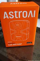 Retail box showing AstroAI portable car air pump branding and flow rate