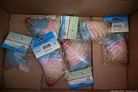 Six packs of plastic badminton birds in box