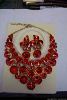 Full view of rhinestone necklace and earrings set