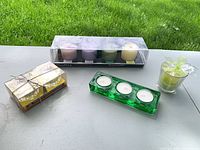 All candle sets and holders displayed together on table