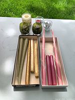 All candles and holders laid out on table