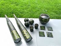 Full set displayed: two columns, three spheres, two votives, bowl, four coasters