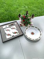 Overview of bowl, boxed tile and spreader, candelabra on tile