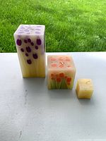 Three candles together showing relative sizes