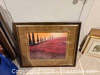Front view of framed landscape floral print