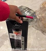 Front of boxed personal blender