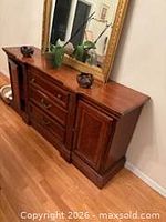 Front left view showing cabinet door ajar, drawer stack, overall finish