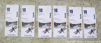 Six identical Heritage Rivers stamp booklets laid out