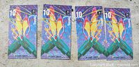 Front view of four identical Olympic stamp booklets