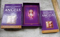 Open box with guidebook and card back design