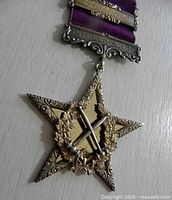 Front view of star badge with ribbon and bars
