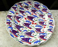 Front view of signed Turkish Iznik style ceramic plate