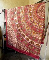 Full view of large printed textile hanging to show overall design