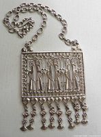 Front view of necklace showing pendant details and chain