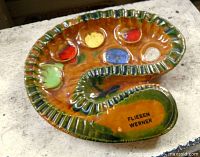 Top view showing coloured wells, rim detail and maker mark