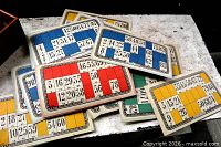 Stacked coloured lottery cards with numbers