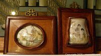 Front view of both framed tiles showing artwork and frames