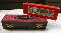 Black Super Chromonica 260 case and red Hohner Echo box