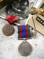 Medals, photo, button and pill box grouped