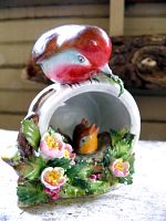 Front view showing robin on log and floral detail