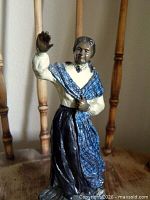 Full view of bronze Scottish woman figure waving on wood base