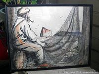 Full view of framed artwork showing fisherman, nets, Rocher Percé