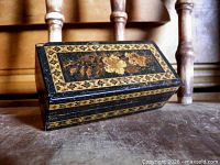 Top view showing rose motif straw marquetry panel and geometric border