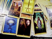 Spread of Tarot of the Sacred Feminine cards showing artwork and border design